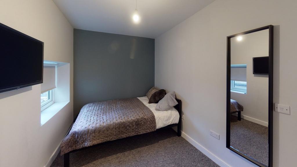 A stylish and inviting double bedroom featuring...