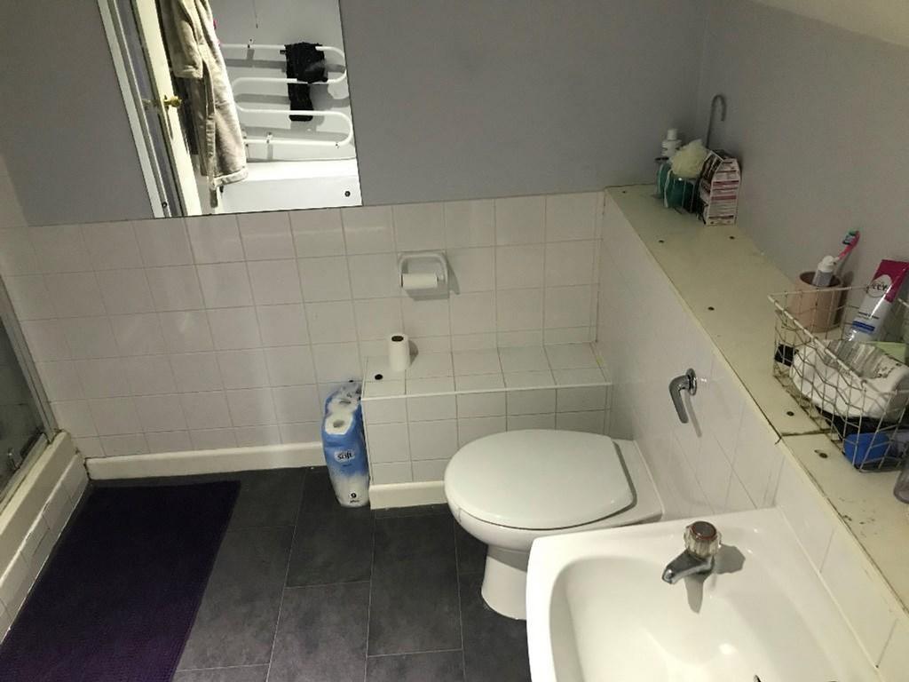 A well-maintained bathroom featuring a modern d...