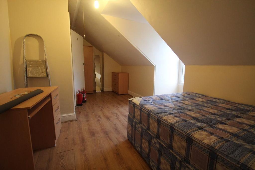 This charming double bedroom features a cozy la...