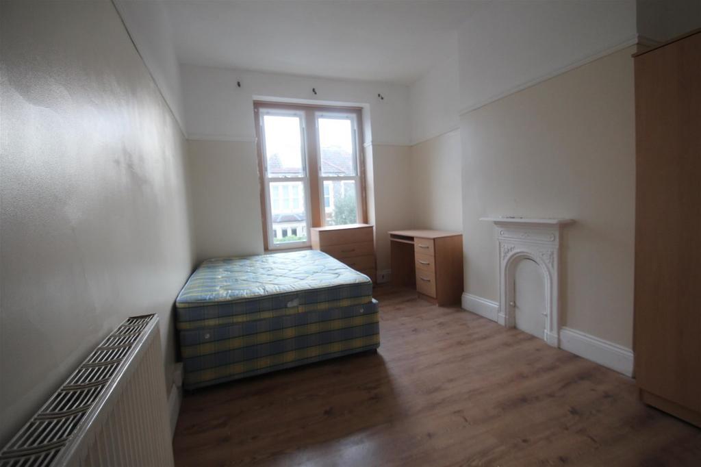 Bright and airy double bedroom featuring a comf...