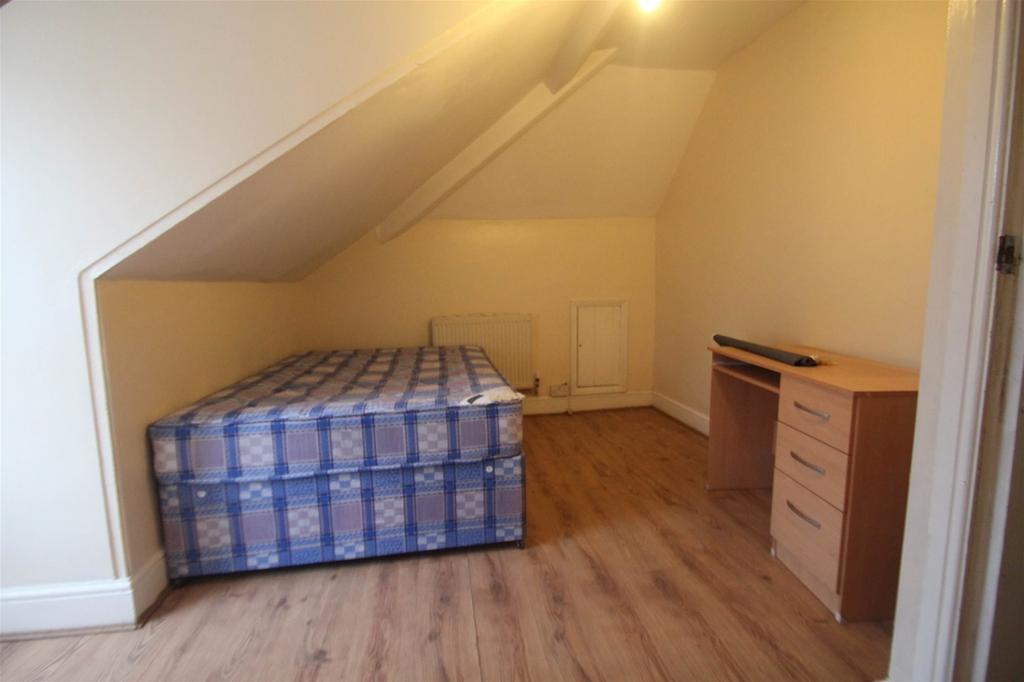 This charming double bedroom features a cozy la...