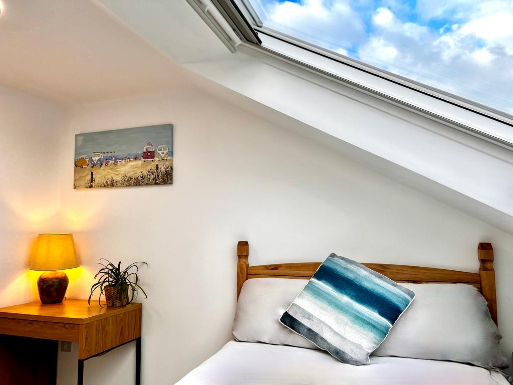 This charming double bedroom features ample nat...