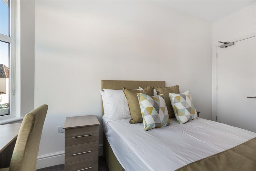A beautifully designed double bedroom featuring...