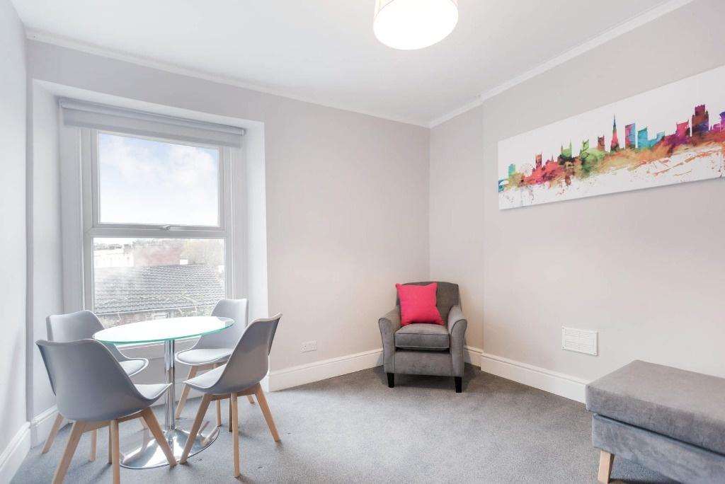 This modern living room features a bright and a...