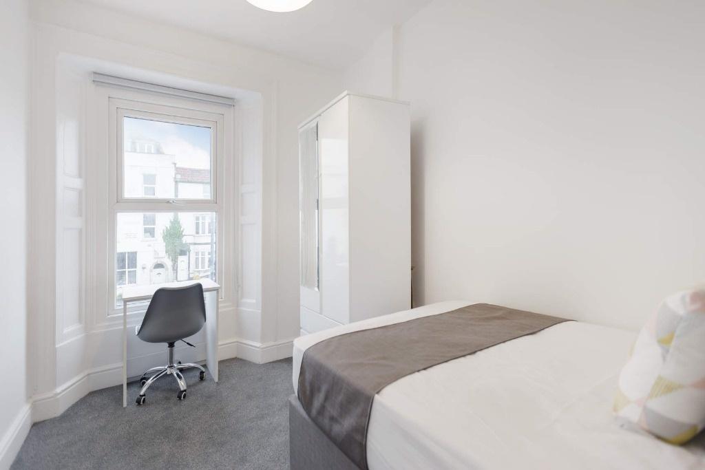 Bright and inviting double bedroom featuring a ...