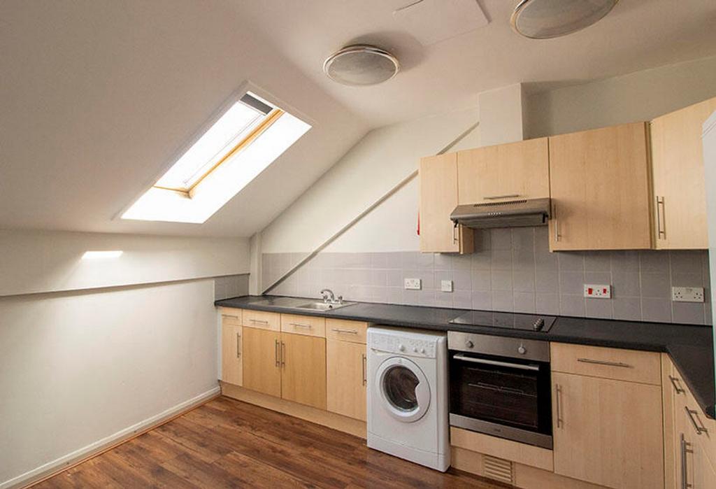 This modern kitchen features ample storage with...
