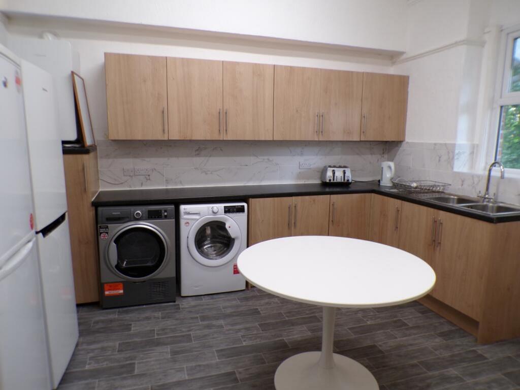 This modern kitchen features ample storage with...