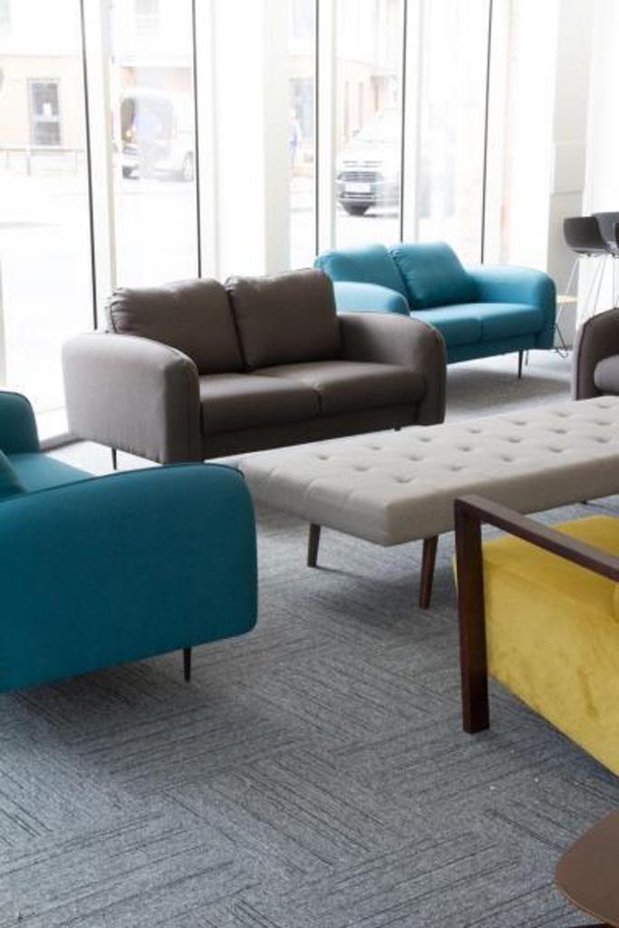 A bright and inviting communal lounge area feat...