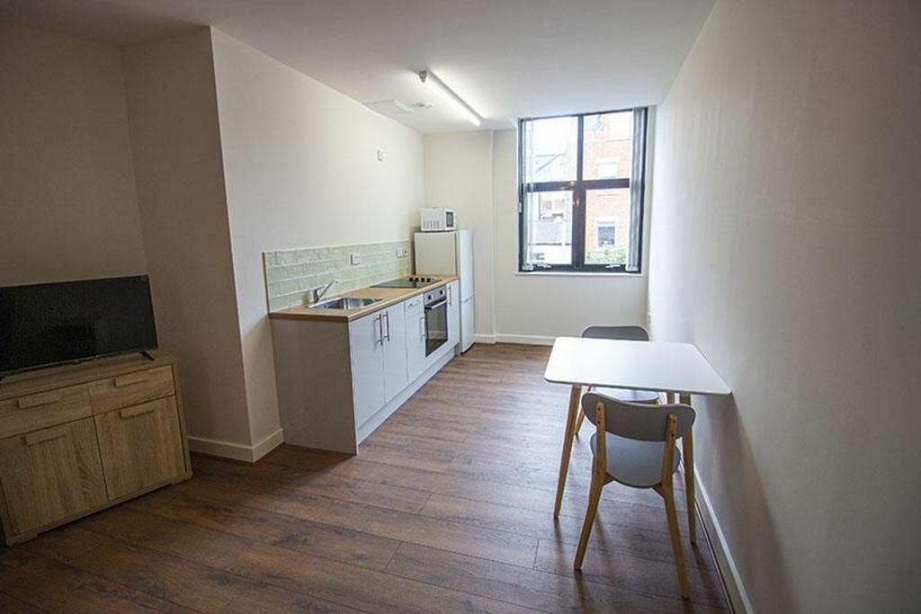 Modern kitchen area featuring ample counter spa...