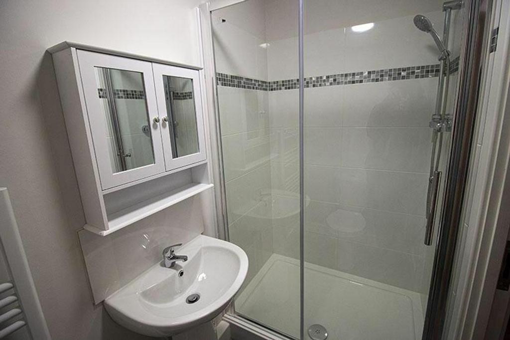 Experience a modern bathroom featuring a stylis...