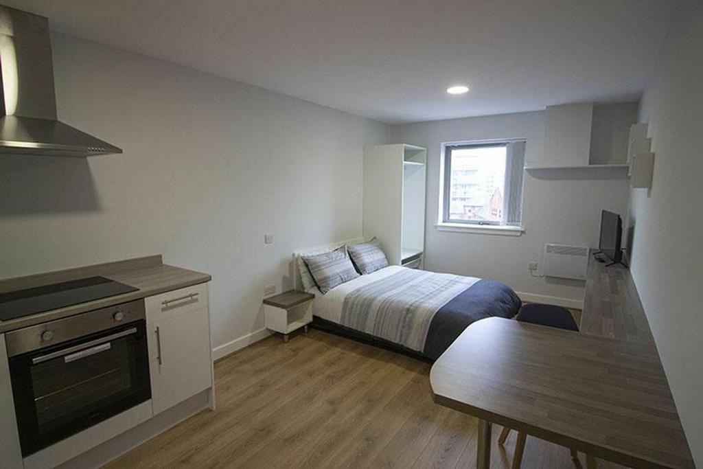This stylish double bedroom features ample natu...