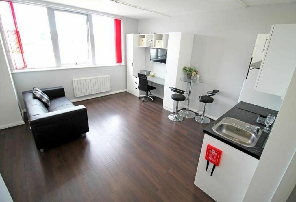 Stylish and modern kitchen area featuring sleek...