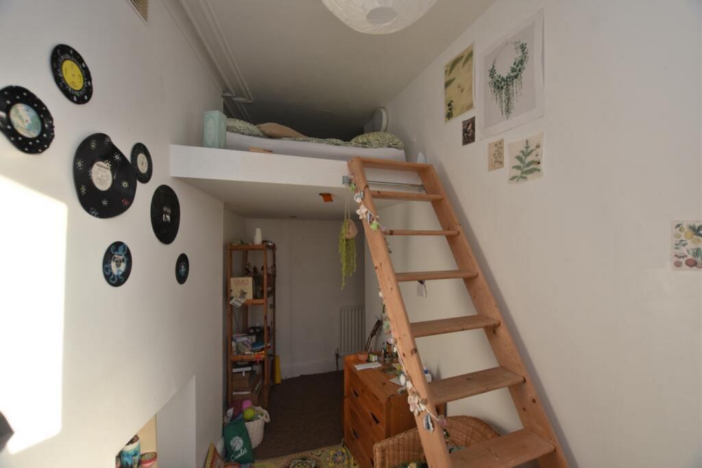 This charming double bedroom features a cozy lo...