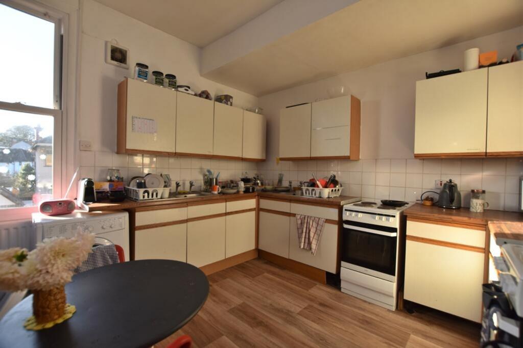 This inviting kitchen features ample cupboard s...