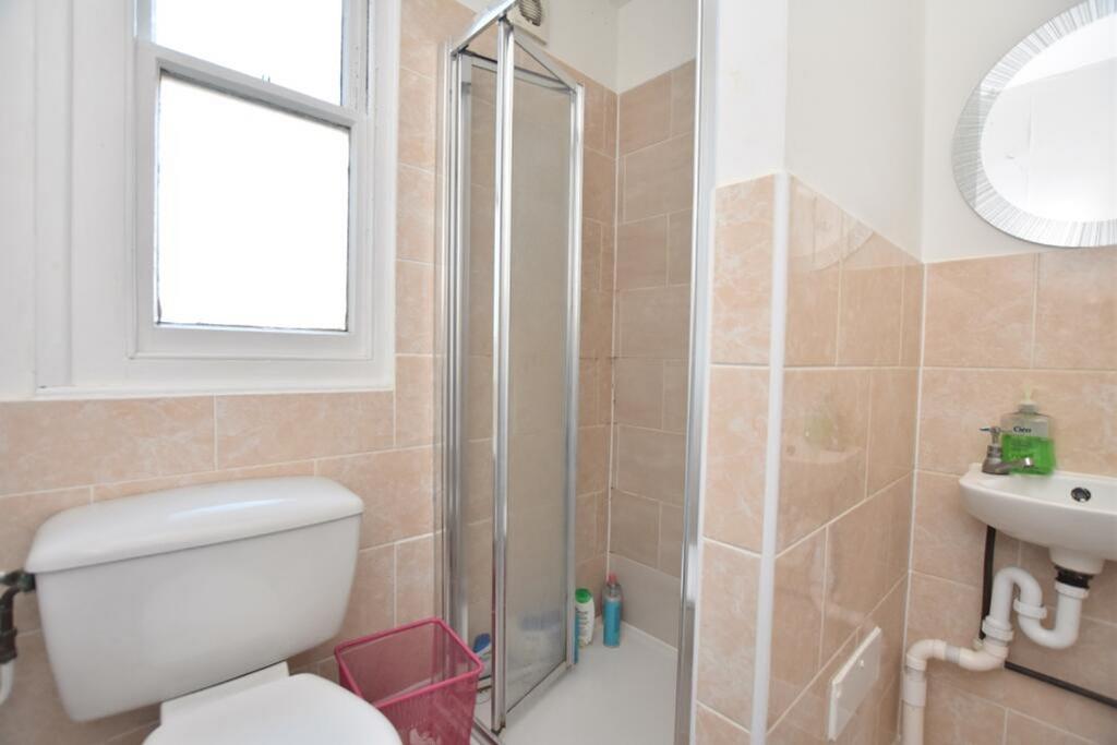 Bright and modern bathroom featuring a spacious...