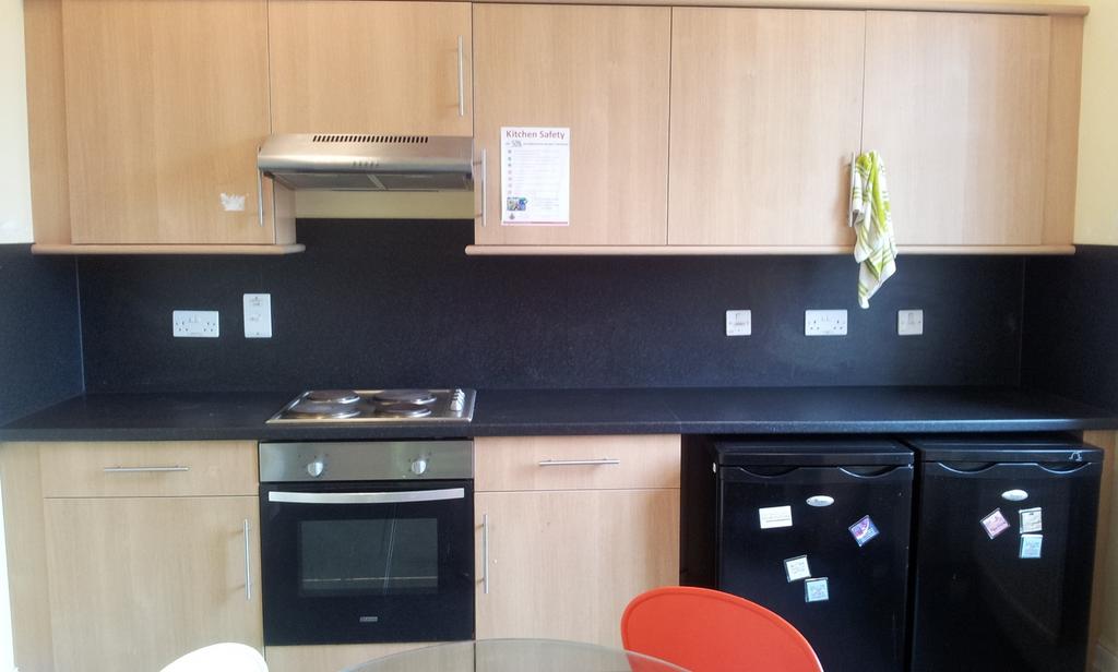 A tidy and functional kitchenette with modern a...