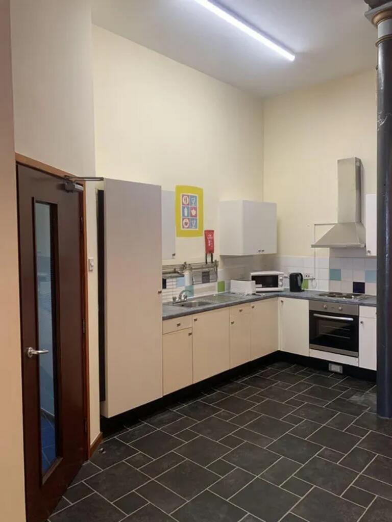 Bright and spacious kitchen featuring modern ap...