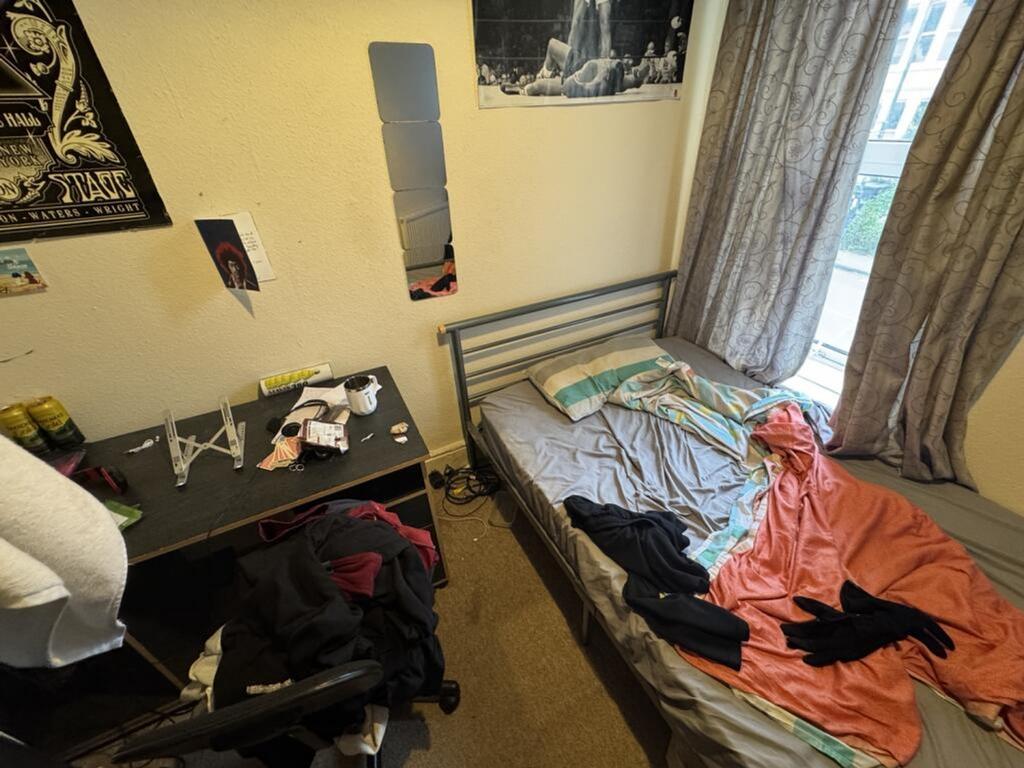 Cozy double bedroom featuring a comfortable bed...