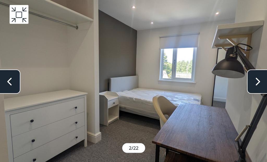 A spacious and well-lit double bedroom featurin...