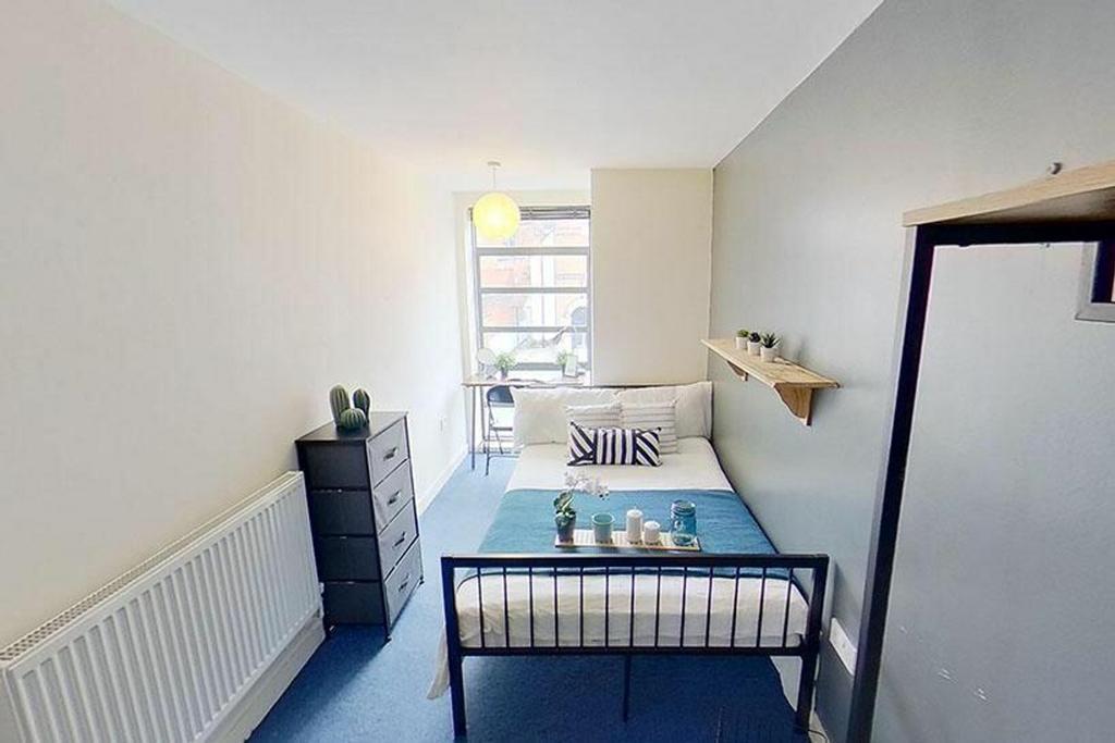 This inviting double bedroom features a cozy la...