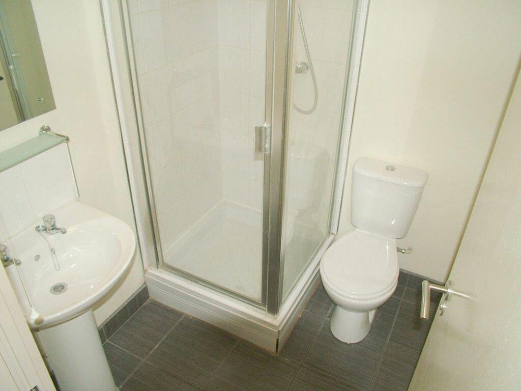 A well-maintained bathroom featuring a modern s...