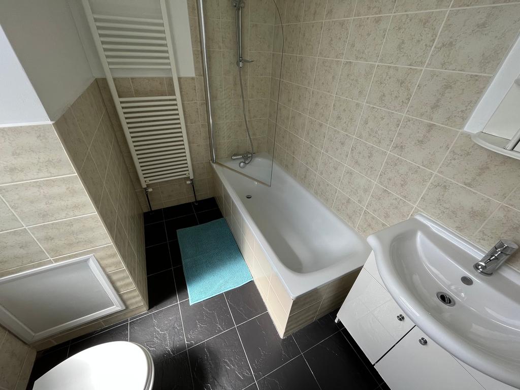 This well-maintained bathroom features a clean ...