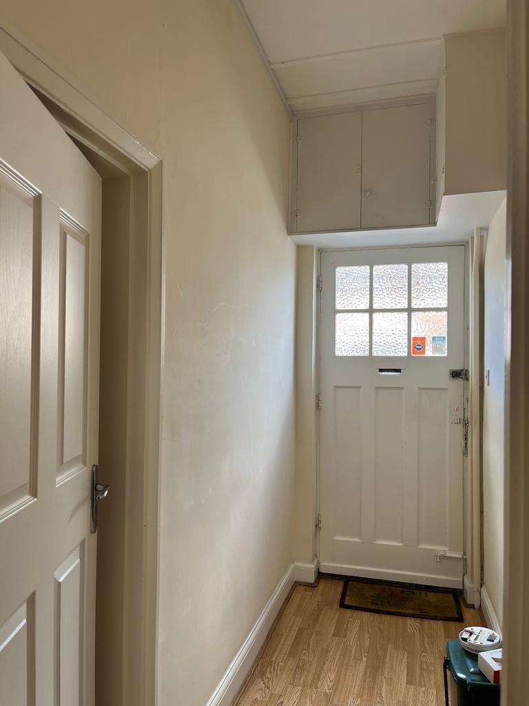 Welcoming hallway with natural light, featuring...