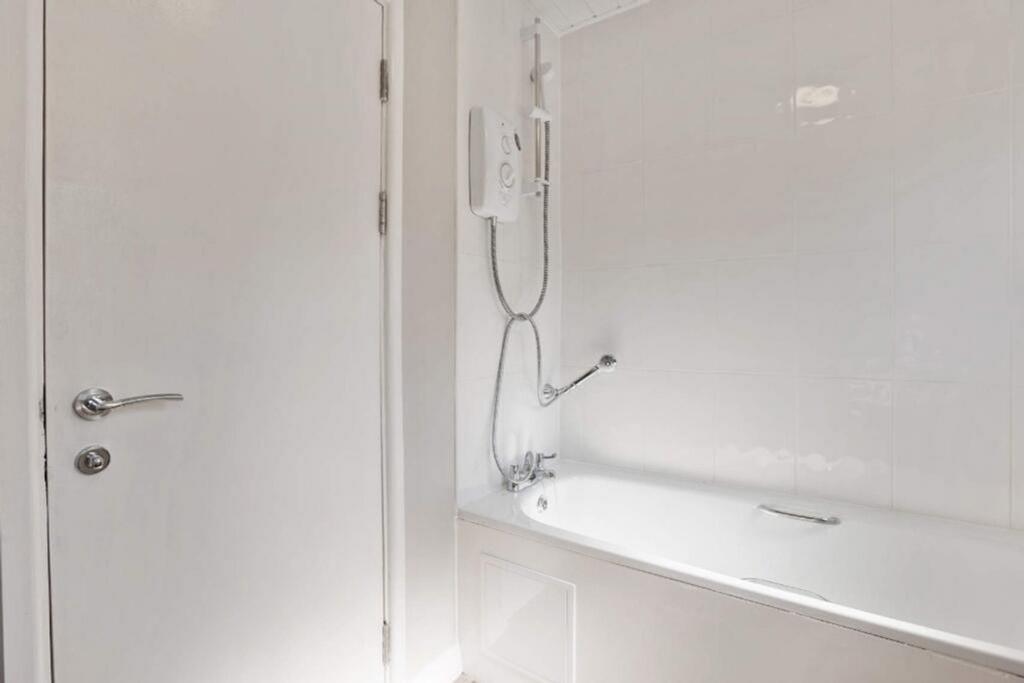 A bright and well-maintained bathroom featuring...
