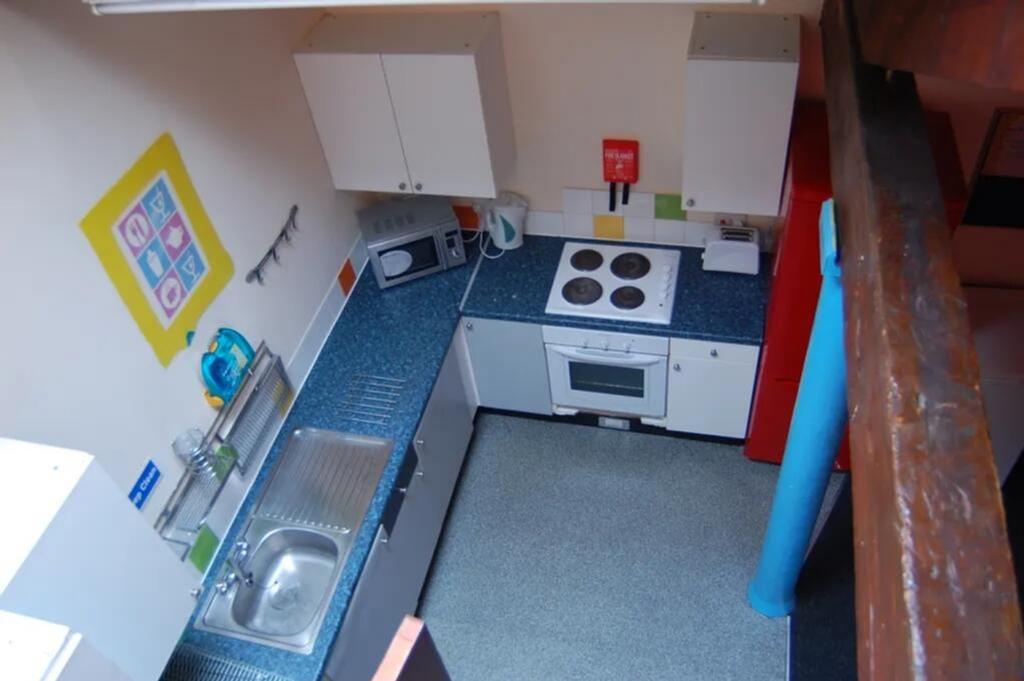 A well-equipped kitchen with ample counter spac...