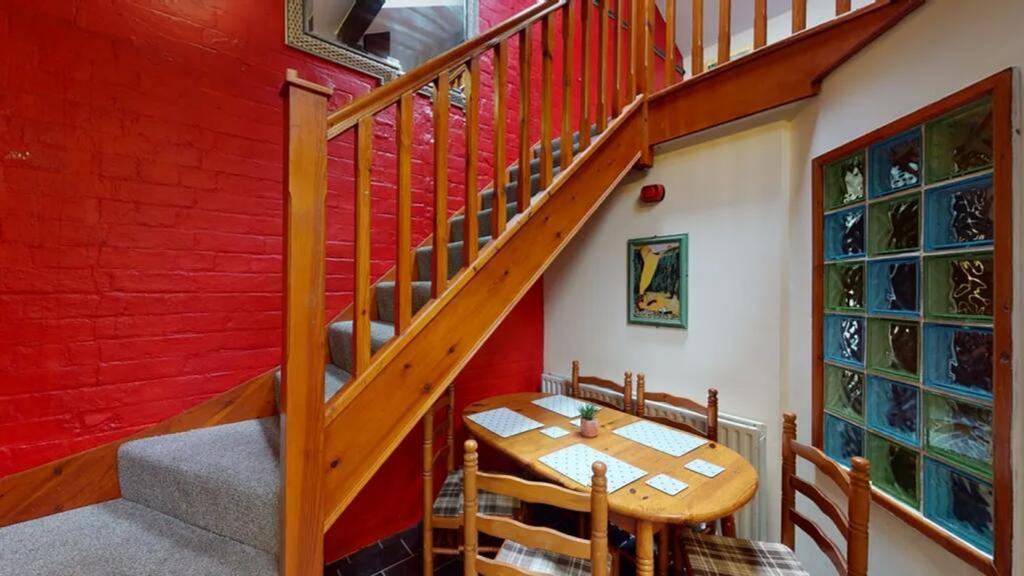 A charming and inviting hallway featuring a coz...