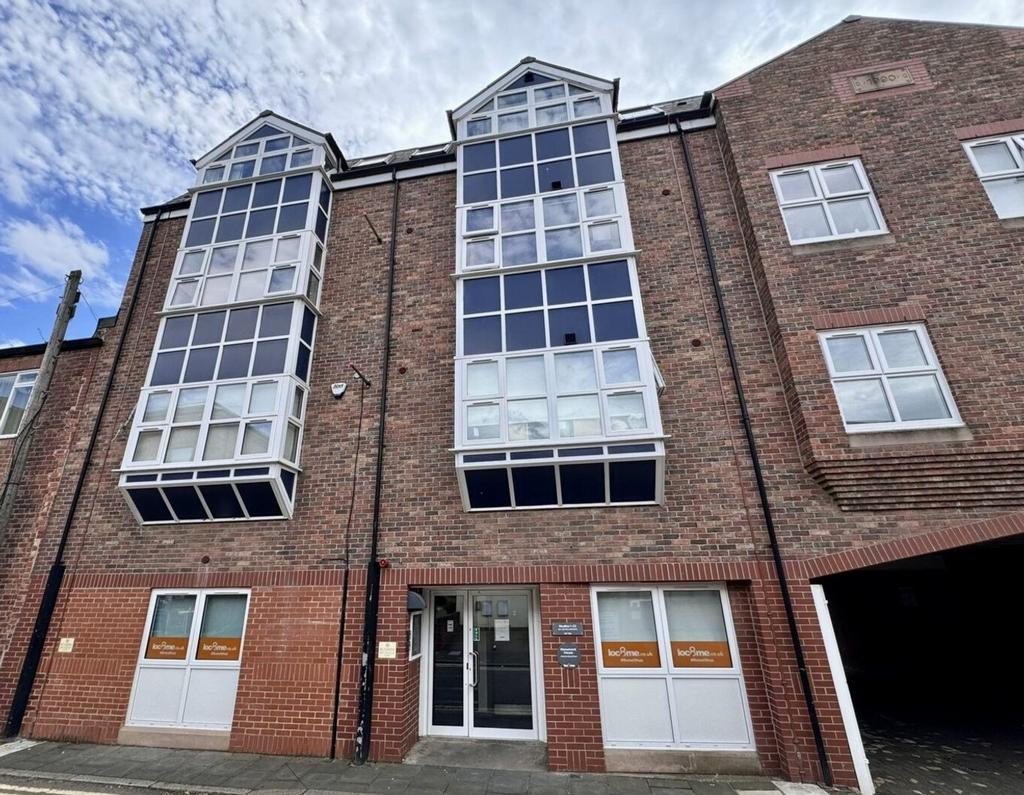 A welcoming exterior view of a modern brick bui...