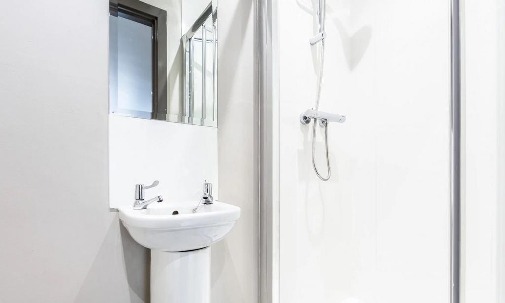 A modern and clean bathroom featuring a sleek d...