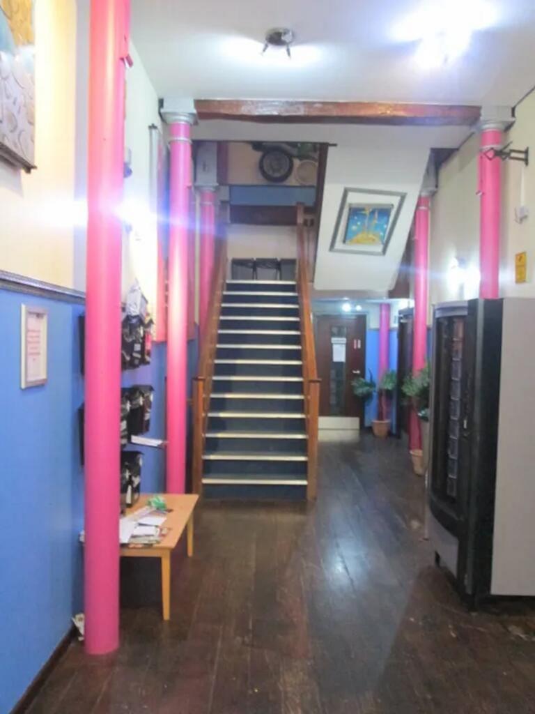 A vibrant and spacious hallway featuring colorf...