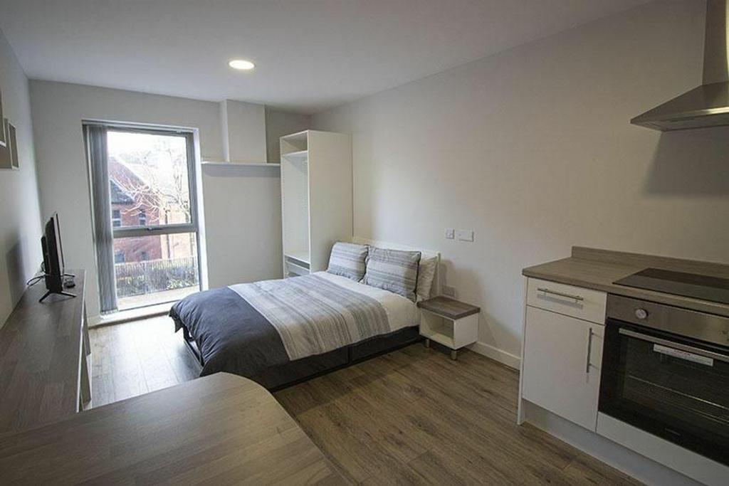 A bright and inviting double bedroom featuring ...