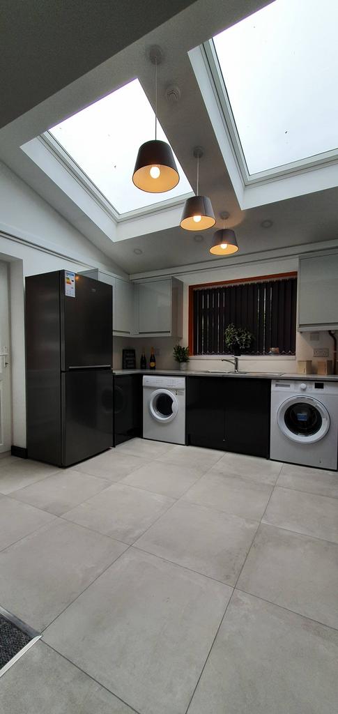 Modern kitchen featuring sleek appliances and a...