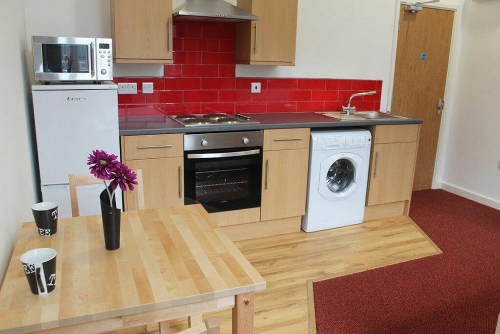 This modern kitchen features a stylish design w...