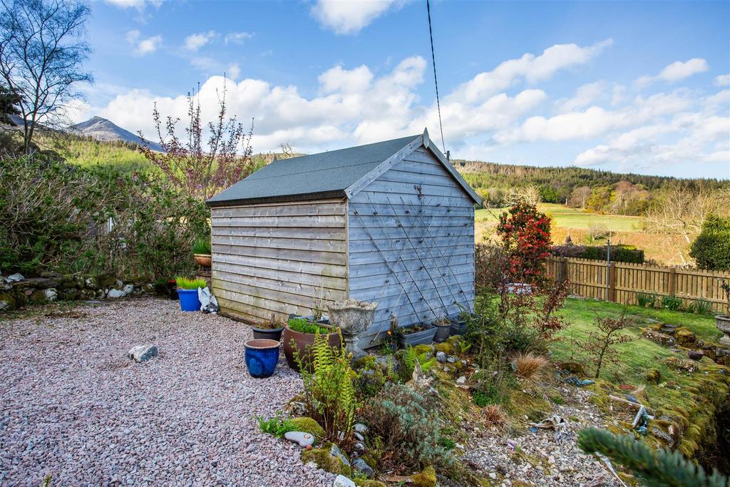 Timber shed and parking area