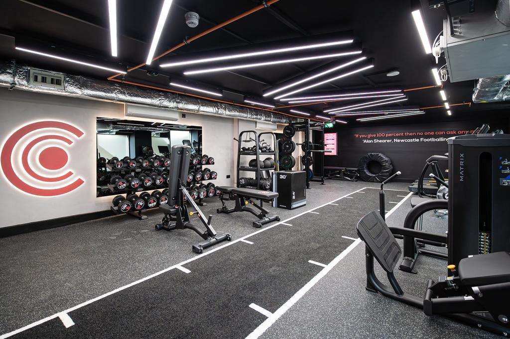 A modern and well-equipped gym featuring ample ...