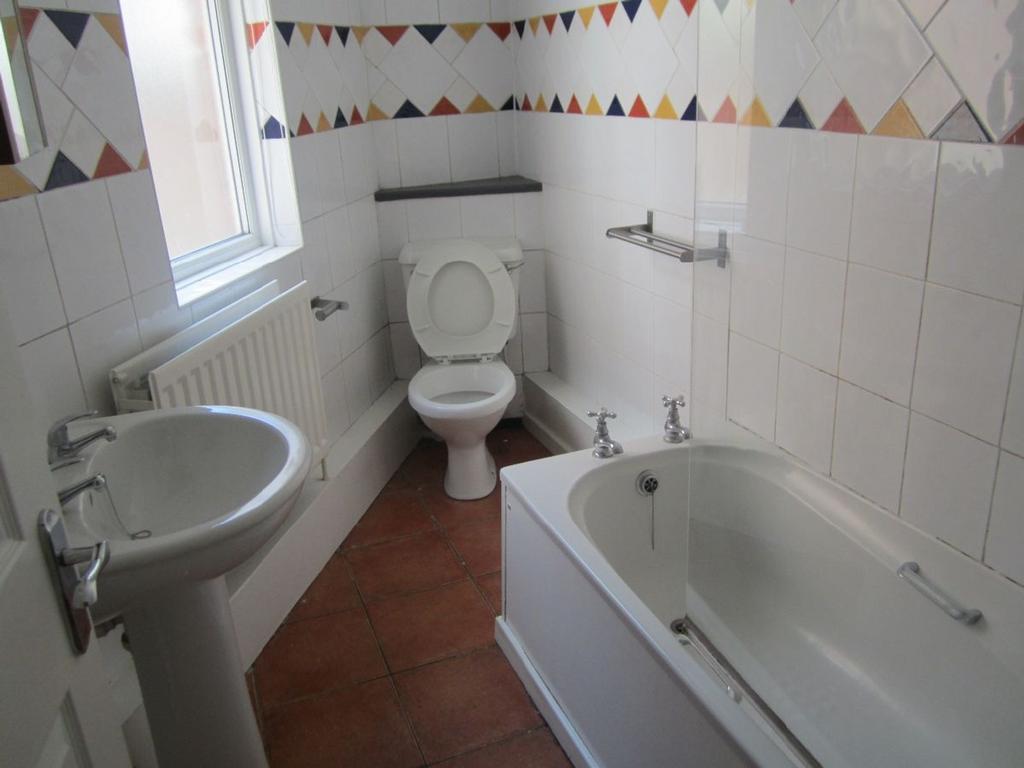 Bright and spacious bathroom featuring a modern...
