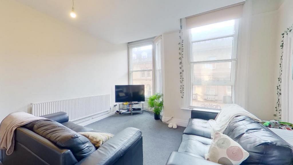 A spacious and bright modern living room with l...