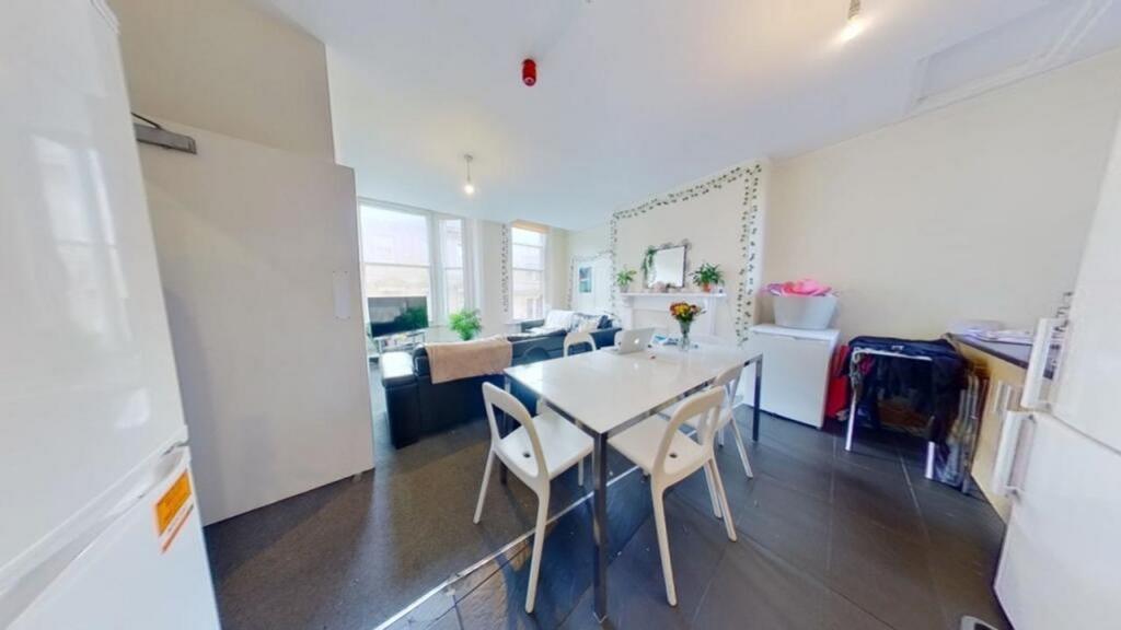 A bright and spacious kitchenette with modern f...
