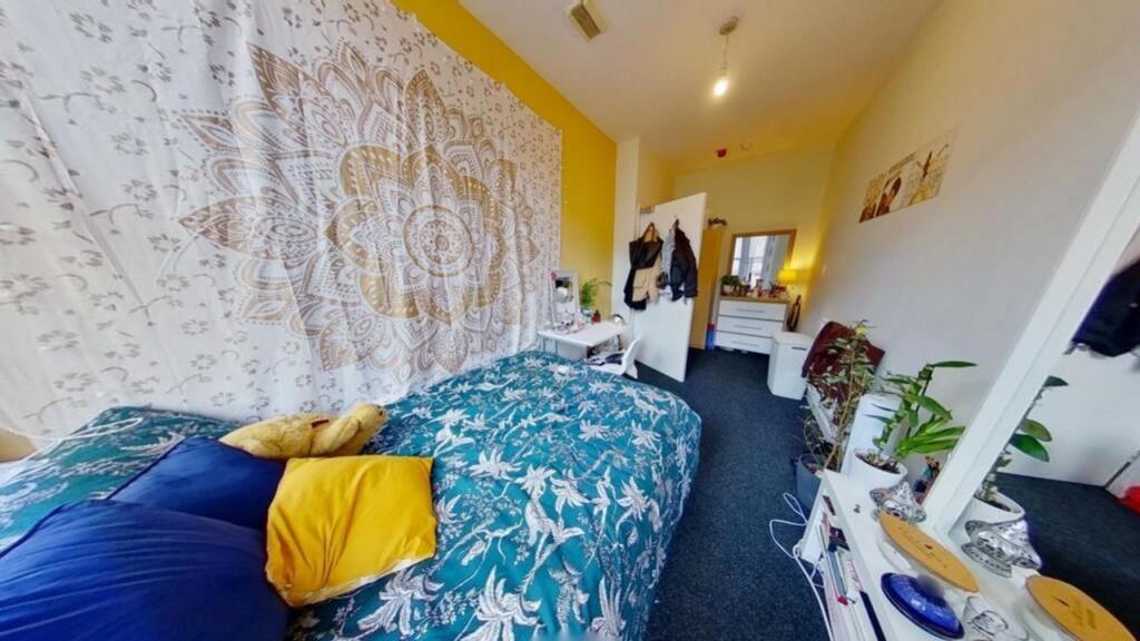 A vibrant and inviting double bedroom featuring...