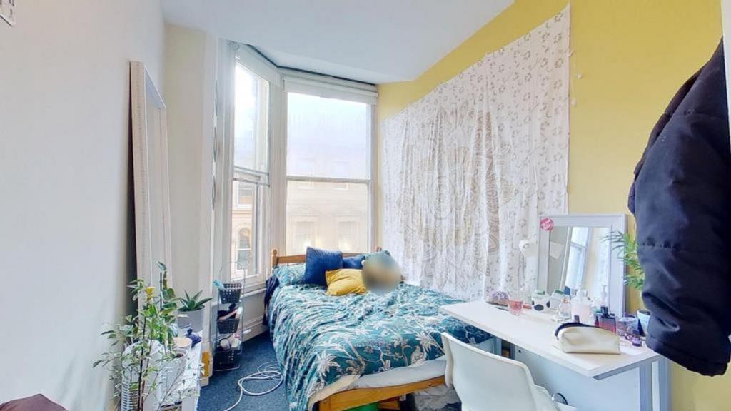A bright and cozy double bedroom with ample nat...