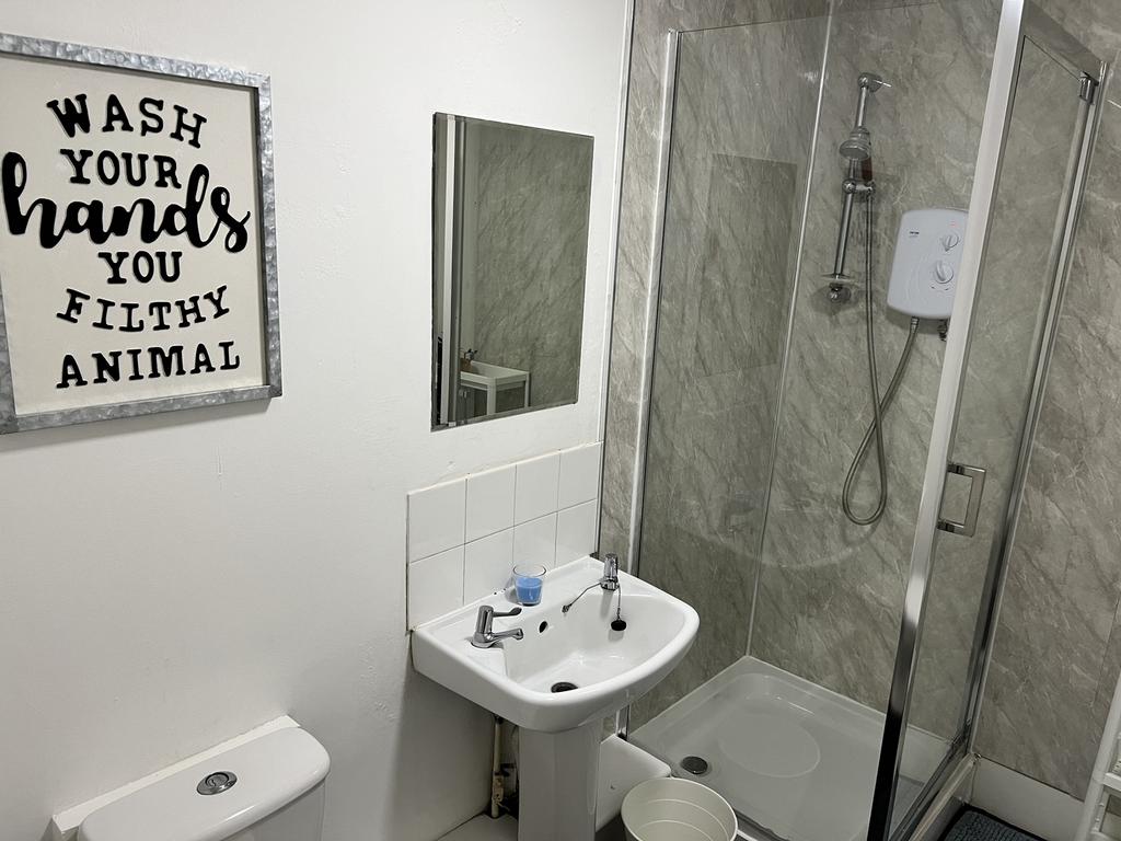 Modern bathroom featuring a sleek shower, styli...