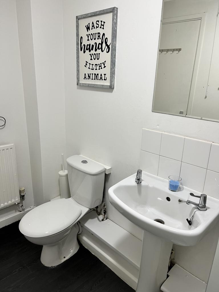 A well-maintained bathroom featuring modern fix...
