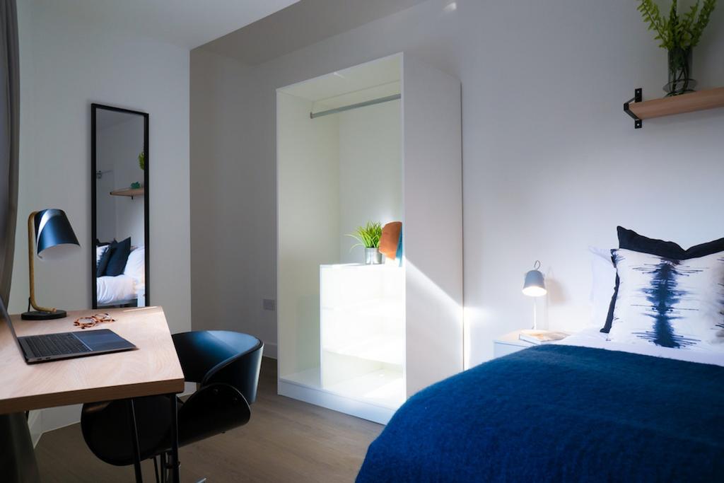 A bright and inviting double bedroom featuring ...