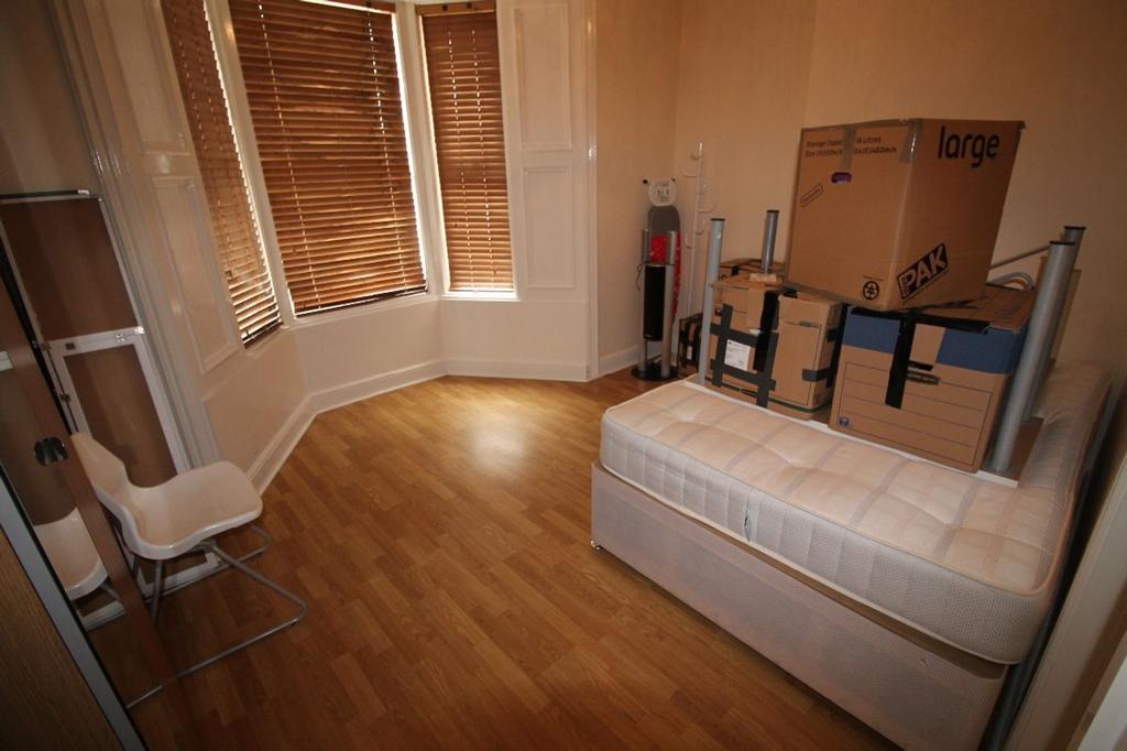 Spacious double bedroom with ample natural ligh...