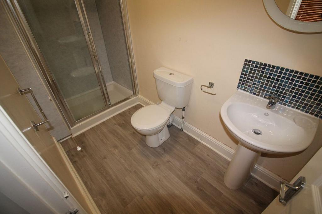 A modern bathroom featuring a clean design with...