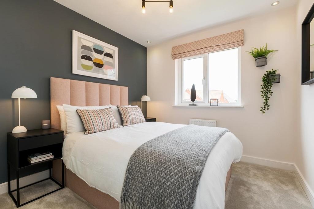 A spacious second double bedroom creating the...