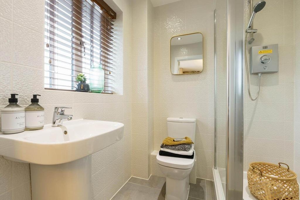 The en suite with high quality fixtures and...